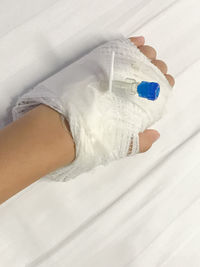 Cropped image of hand wrapped in bandage at hospital