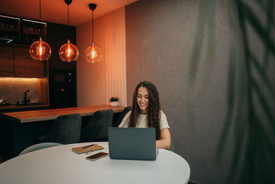 Young girl working at home