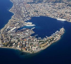 High angle view of sea and buildings in city