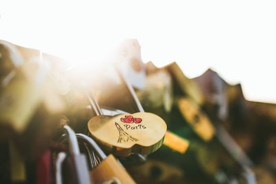 Close-up of heart shape hanging on metal