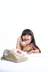 Portrait of a smiling young woman over white background