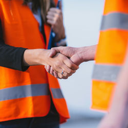 Close-up of engineers shaking hands