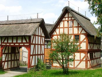 Exterior of house by building against sky