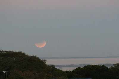 Scenic view of moon against clear sky at night