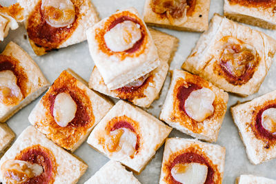 Mini pizzas on a white background, top view