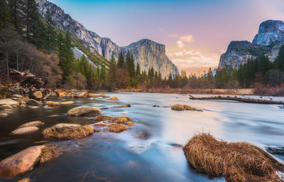 Scenic view of rocks against sky during sunset