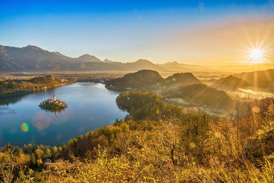 Scenic view of mountains against sky at sunset