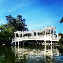 View of built structure by calm blue sea