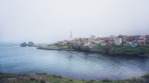 View of sea with buildings in background