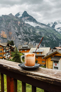 Switzerland, jungfrau. swiss alps. cozy  small village in mountains. morning hot cup of coffee.