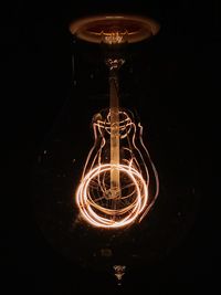 Low angle view of illuminated light bulb