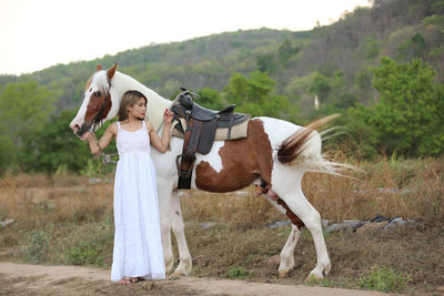 Full length of woman standing on land