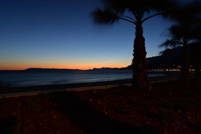 Scenic view of sea against sky at sunset