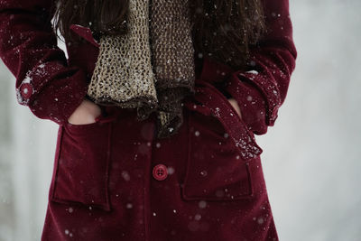 Close-up of woman with red umbrella