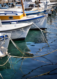 Boats moored at harbor