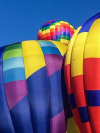 Low angle view of hot air balloon against blue sky