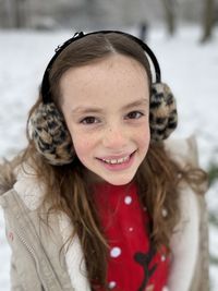 Portrait of cute smiling girl during winter