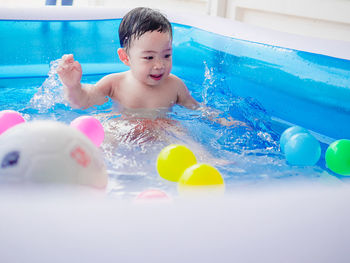 High angle view of boy swimming in pool