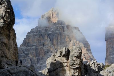 Low angle view of rock formations against sky