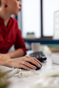 Young woman using laptop at table