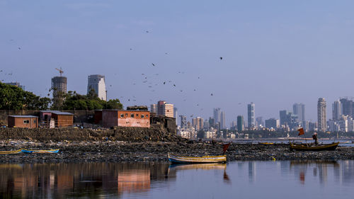 View of city buildings against sky