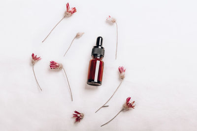 Abstract cosmetic laboratory. bottles of dark amber glass on a white background organic flax. 