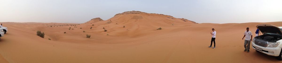 Panoramic view of desert against clear sky