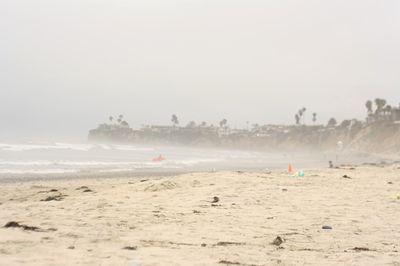 Scenic view of beach against clear sky