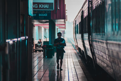 Blurred motion of train at railroad station