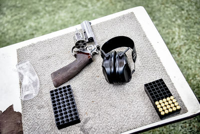 High angle view of shooting equipment on table at front or back yard