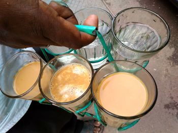 High angle view of hand holding drink