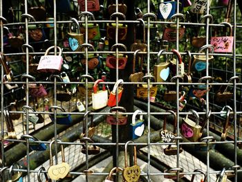 Close-up of padlocks hanging on metal chain