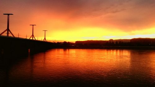 Scenic view of river at sunset