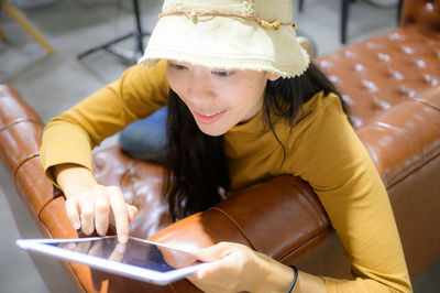 Midsection of woman using mobile phone