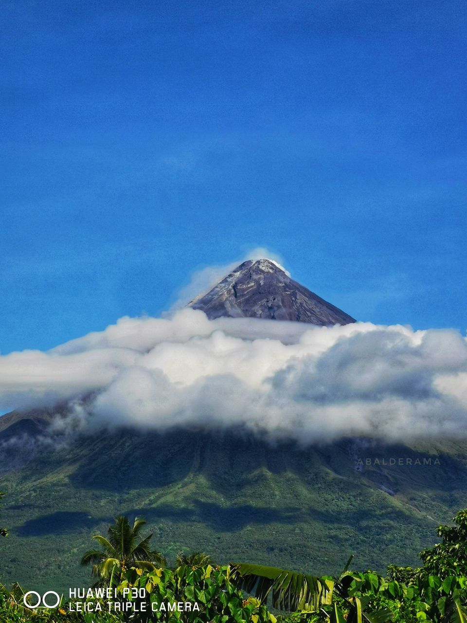 mountain, volcano, sky, landscape, environment, stratovolcano, beauty in nature, scenics - nature, plant, nature, volcanic landscape, land, cloud, no people, mountain peak, travel destinations, volcanic crater, mountain range, plateau, blue, geology, travel, non-urban scene, outdoors, tree, plain, active volcano, day, cinder cone, tourism, smoke, tranquility, tranquil scene, wilderness, erupting, physical geography