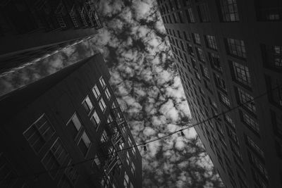 Low angle view of buildings against sky in city