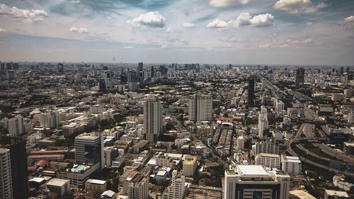 High angle view of modern buildings in city against sky