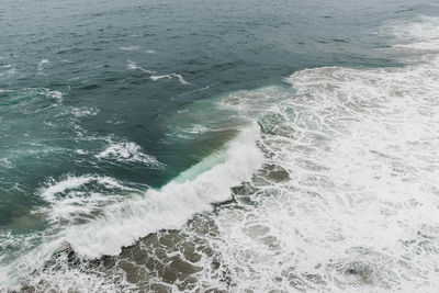 High angle view of surf on beach