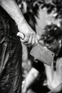 Close-up of man holding hands