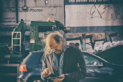 Full length of man looking at city