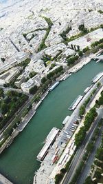 High angle view of river amidst buildings in city