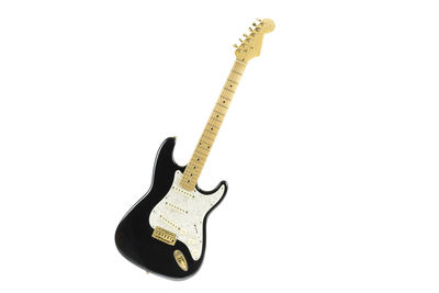 View of guitar against white background