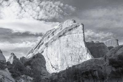 Low angle view of rock formation against sky