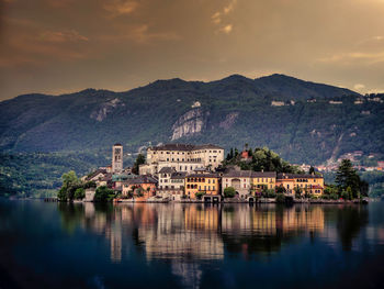 Scenic view of lake and mountains against sky