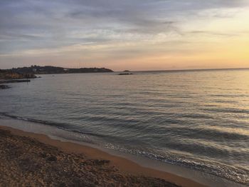 Scenic view of sea against dramatic sky