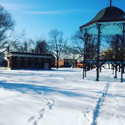 Snow covered field against sky