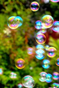 Close-up of bubbles against blue sky