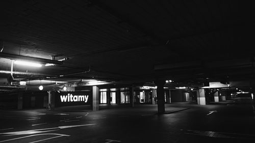 Illuminated underground walkway at night