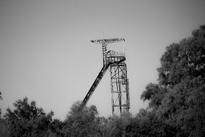 Low angle view of communications tower against clear sky