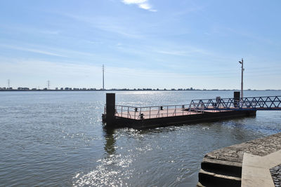 Pier over sea against sky